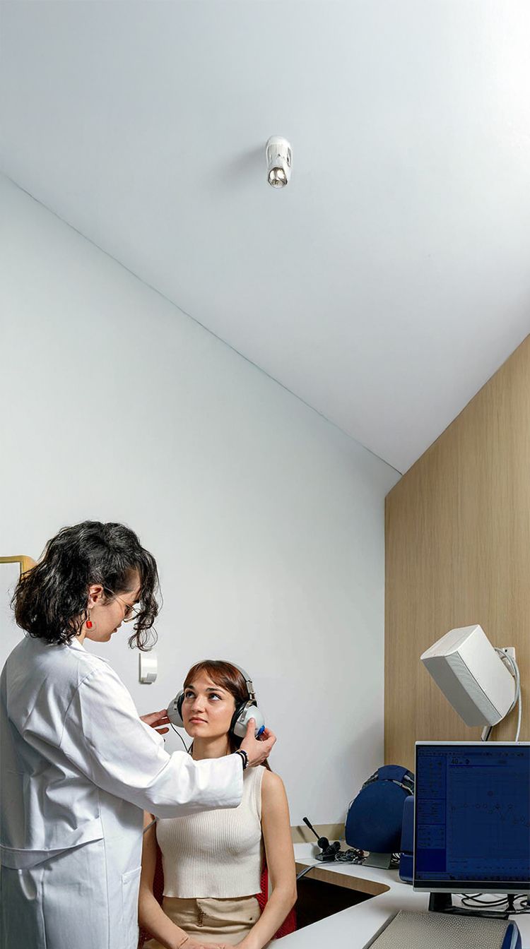 Hearing test in Battersea, London: audiologist assessing an adult patient for hearing loss, tinnitus or blocked ears.
