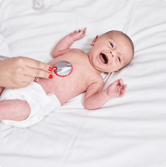 Doctor performing a baby check at a private children’s health clinic in London
